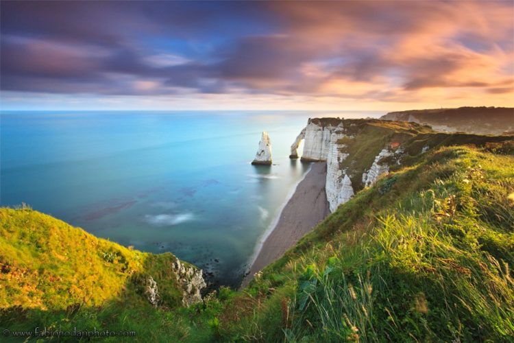 sunrise over the cliff of etretat in normandy france